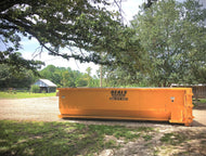 Landscape dumpster rental for yard debris, brush removal, and tree cleanup in South Louisiana